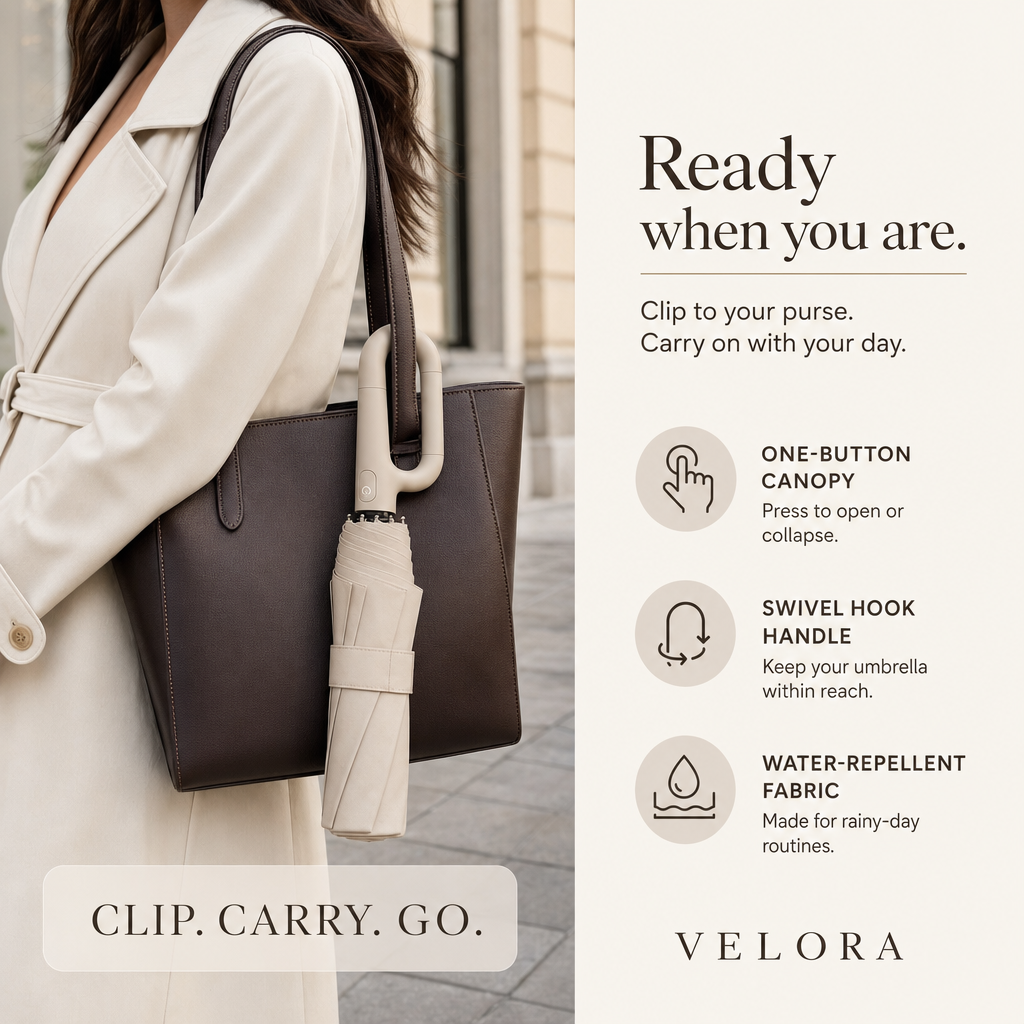 Velora beige umbrella clipped to a women's leather purse